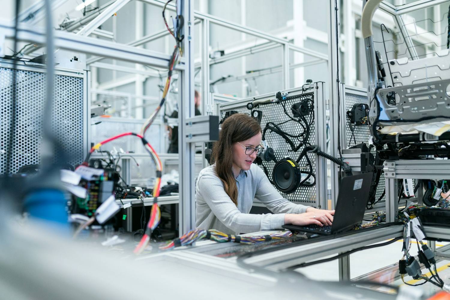 Engineer configuring an automated electro-mechanical assembly cell